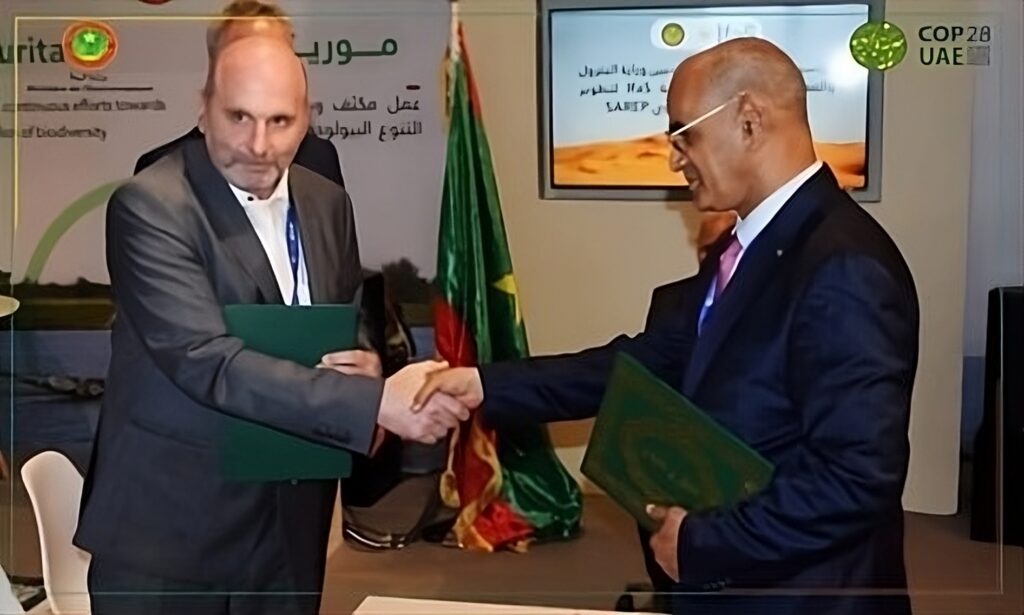 Handshake between Prof. Dr. Peter Heck and Minister for Petroleum, Energy and Mines, Mr. Nany Chrougha after the Signing Ceremony